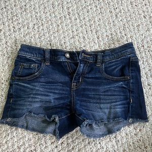 Stretchy, dark washed denim shorts.